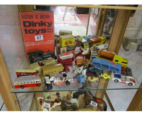 Shelf of die cast cars etc
