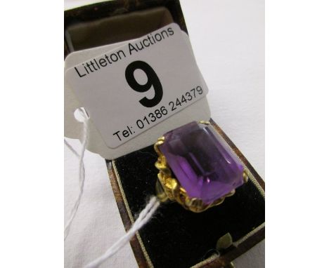 Gold ring set with a large amethyst