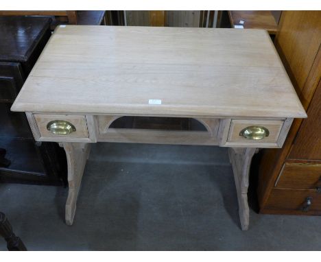 A light ash two drawer writing table 