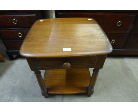 An Ercol Golden Dawn elm lamp table 