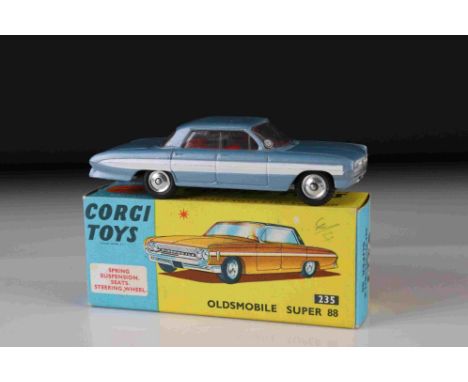 Boxed Corgi 235 Oldsmobile Super 88 diecast model in metallic steel blue with red interior, diecast vg/ex and ex box 