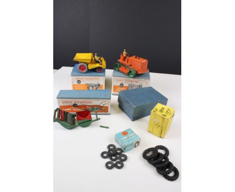 Three boxed Dinky Supertoys diecast models to include 563 Heavy Tractor in orange, 562 Dumper Truck in yellow and 751 Lawn mo