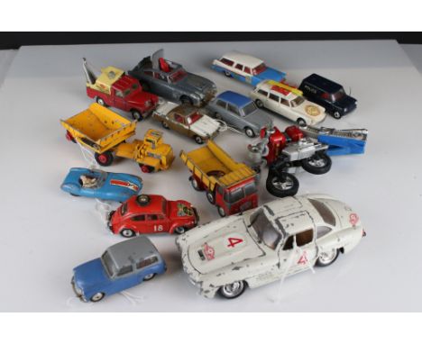 13 Mid 20th C play worn diecast models featuring mainly Corgi examples to include Citroen Safari, Austin A40, Volkswagen 1200