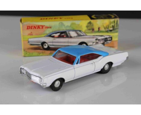 Boxed Dinky (Hong Kong) 57 / 004 Oldsmobile 88 diecast model in white with blue roof, red interior, diecast and box vg 