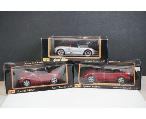 Three boxed Maisto 1:18 scale diecast models to include Porshce Boxster, Audi TT Roadster and 2003 SVT Mustang Cobra, models 