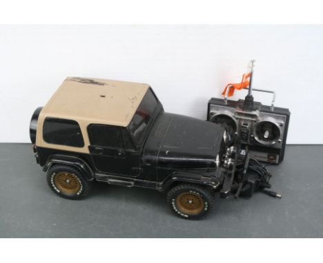 A Tamiya Jeep Wrangler 1/10 scale RC street car c.1994 ABS Body on CC-01 chassis together with Futaba Attack controller and c
