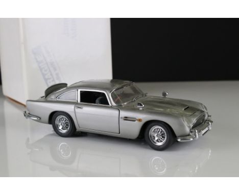 Boxed 1:24 scale Danbury Mint The James Bond 007 Aston Martin DB5 in silver with certificate, model showing some signs of wea