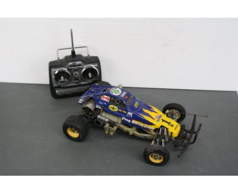 A Tamiya The Frog 58041 vintage remote control buggy, 2WD 1/10 scale c.1983 polycarbonate body, original ORV chassis with Aco