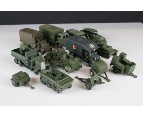 13 Mid 20th C military diecast models and artillery, mainly Dinky examples to include 623 Army Wagon, some play wear and repa