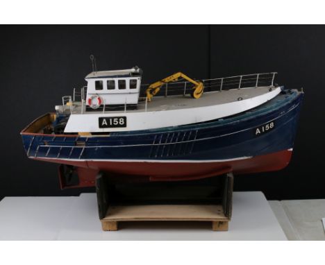 Remote Control 'A158' boat on stand with engine, top part removed from body to allow for engine 