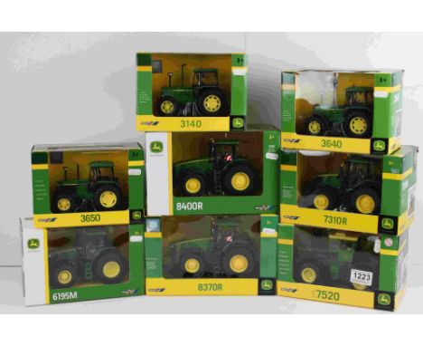 Eight boxed 1:32 Britains John Deere diecast tractor models to include 3650, 6190M, 8400R, 3640, 7520, 3140, 8370R &amp; 7310