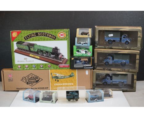 A collection of 11 boxed model vehicles to include Oxford 1/76 scale MGB, Union Jack Austin Min and a Jaguar E-Type together 