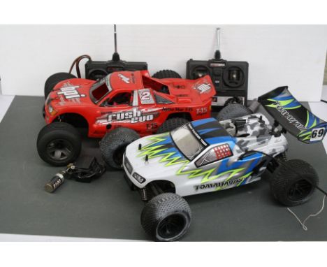 A HPI Racing Rush Evo 2WD stadium truck nitro 1/10 together with a Thunder Tiger Tomahawk ST 1/10 scale Truggy Nitro, two con