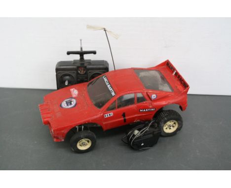 A Tamia Lancia Rally 1/10 scale remote control car 58040 c.1983 on ORV chassis with high impact sterol body together with Aco