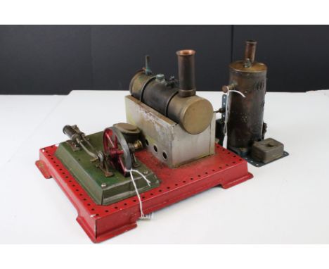 Two stationary steam engines to include steam plant on red base and a Meccano marked engine with boiler, both showing wear