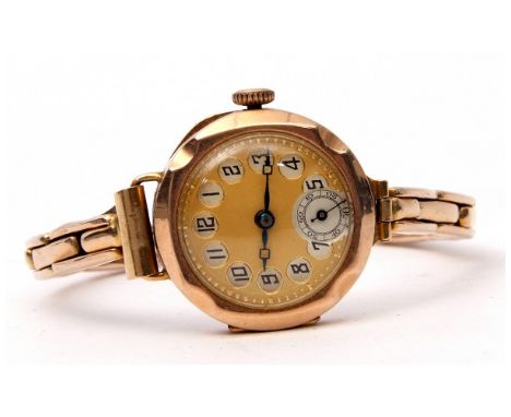 Ladies first quarter of 20th century 9ct gold cased wrist watch with blued steel hands to a gilded dial with black Arabic num