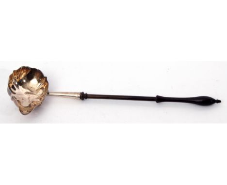 Early George III toddy ladle, the pear shaped bowl with wavy edge, treen handle, London, possibly 1771 (date letter partially