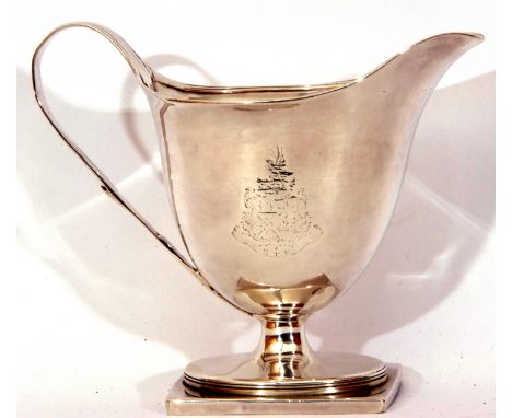 George III helmet shaped milk jug with applied reeded rim and tapering handle (repaired) with a contemporary armorial raised 
