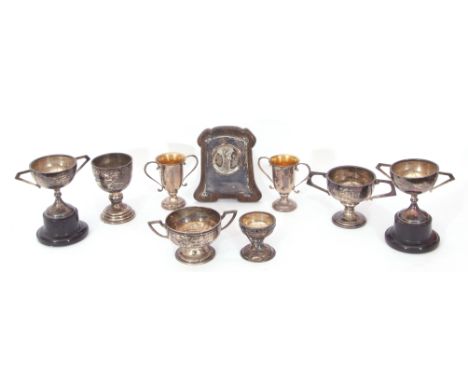 Mixed Lot: seven hallmarked silver small golf presentation trophies and socles, various dates and makers, weighable silver 24