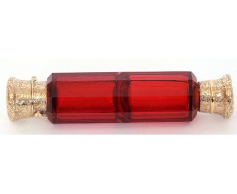 19th century ruby glass scent bottle of faceted form with gilt metal mounts and stopper, 12cm long