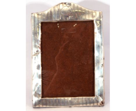 Edward VII silver photograph frame of rectangular form, engine turned geometric engraving with central vacant cartouche, 23 x