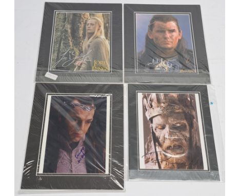 The Lord of the Rings autographed photos x4, to include photos signed by Hugo Weaving, Paul Norell, Jorn Benzon, and Mark Fer
