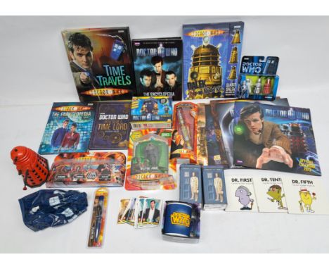 Assortment of Doctor Who action figures, books and ephemera. Including Corgi Daleks, Masters Laser Screwdriver (opened), Weep