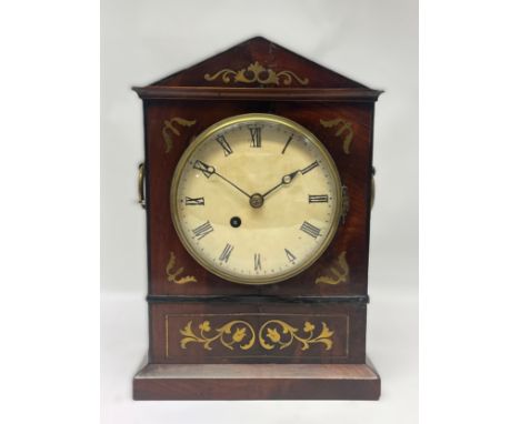 A 19th Century flame mahogany and brass inlaid mantel clock, re-painted convex dial with blued steel hands, single fusee move