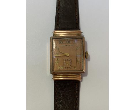 A Longines 10k gold-filled gentleman's wristwatch, c. 1930-40, the rectangular copper finish dial with applied gilt Roman num