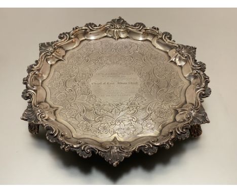 A William IV silver salver, John Welby, London 1831, the scalloped rim boldly chased with c-scrolls and shells, the well with