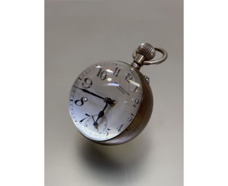 A brass-mounted spherical glass paperweight desk clock, the white enamel dial with Roman numerals and subsidiary seconds dial