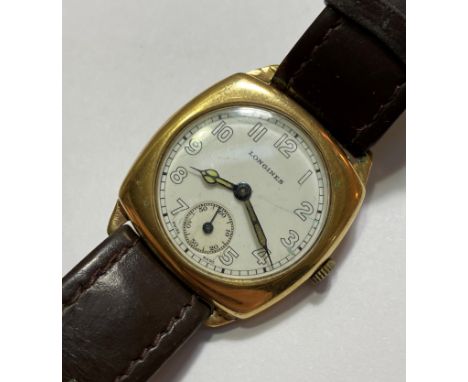 A 1940's 9ct gold Longines gentleman's wristwatch, the white enamel dial with Arabic numerals and with subsidiary seconds dia
