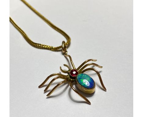 A late 19th century insect pendant, modelled as a spider in yellow metal (indistinctly stamped to the bale), the body formed 