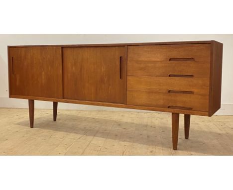 Nils Jonsson for Troeds, A Swedish teak sideboard, circa 1960s, of rectangular outline, fitted with twin sliding doors enclos