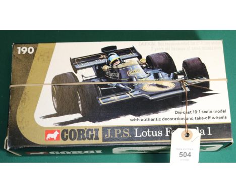 A Corgi Toys 1:18 scale J.P.S. Lotus Formula 1. In black with gold highlighting. 'With authentic decoration and take-off whee