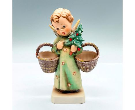 Hand painted winged figure holding two empty baskets and a small Christmas tree. Goebel backstamp. This item has its original