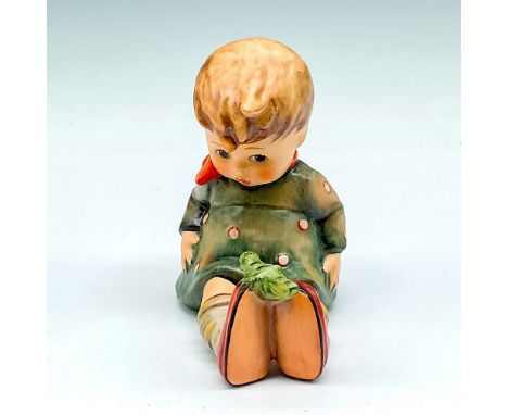 Sweet child staring at her feet where a bug sits. Hand painted in matte finish. Goebel backstamp. M.I. Hummel impressed mark.