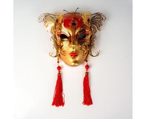 Handmade papier mache full face mask decorated with gold-tone metal filigree in the shape of butterfly wings, ruby red rhines