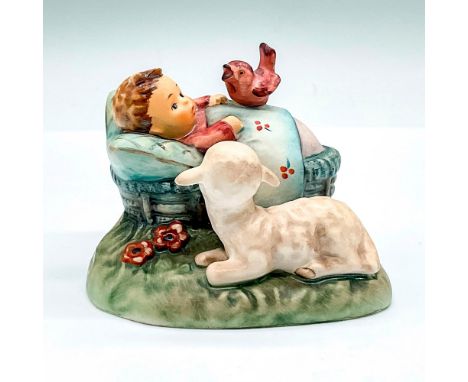 Hand painted figure of a baby in a blue bassinet and a lamb admiring. Goebel backstamp. This item has its original box: 7.5"L
