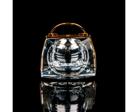 Lead crystal piece with clock interior, finished with gold-tone accents. Swarovski etched backstamp. This item has its origin