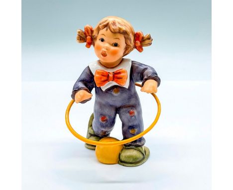 Hand painted figure of a young girl with a hula-hoop. Goebel backstamp. This item has its original box: 7.5"L x 5"W x 3.75"H.