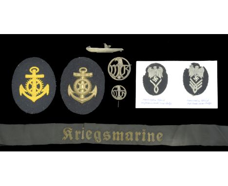 German Second World War Kriegsmarine Insignia. Comprising two naval sleeve badges for a Kriegsmarine Maschinenmaat in metal a