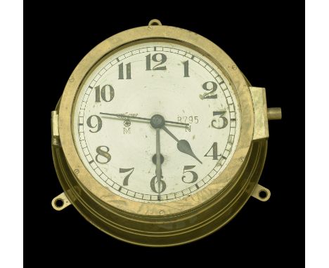 A German Second World War Kriegsmarine Bulkhead Clock. A fully functional Kriegsmarine bulkhead clock, numbered ‘3319’ on the