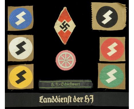 German Second World War Hitler Youth Insignia. White rune on red disc, Bevo woven. White rune on green disc, Bevo woven. Whit