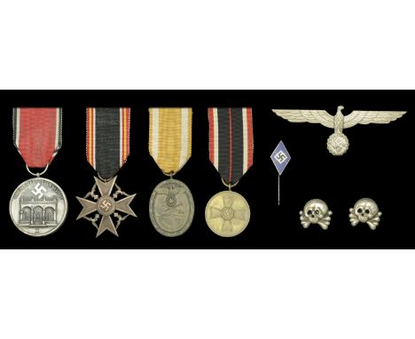 Miscellaneous German Second World War Awards. Comprising a War Merit Medal with its ribbon; a West Wall Medal with its ribbon