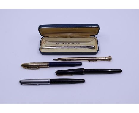 A Mont Blanc Monte Rosa fountain pen a Shaffer fountain pen and a Parker pen together with an Eversharp gilt metal propelling