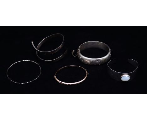 A 9ct gold bangle and a collection of silver bangles&nbsp;