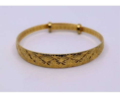 A Chinese yellow metal bangle&nbsp;