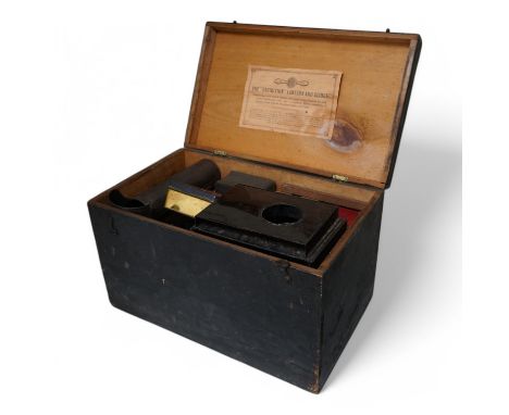 An Exhibition magic lantern and slides, cased, 44cm wide. Condition - commensurate with age and use