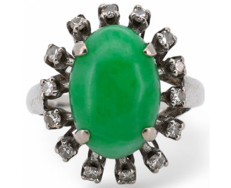 A white metal and cabochon jade set ring, with round cut diamond set border, size N, gross weight 5.4 grams. Condition - fair